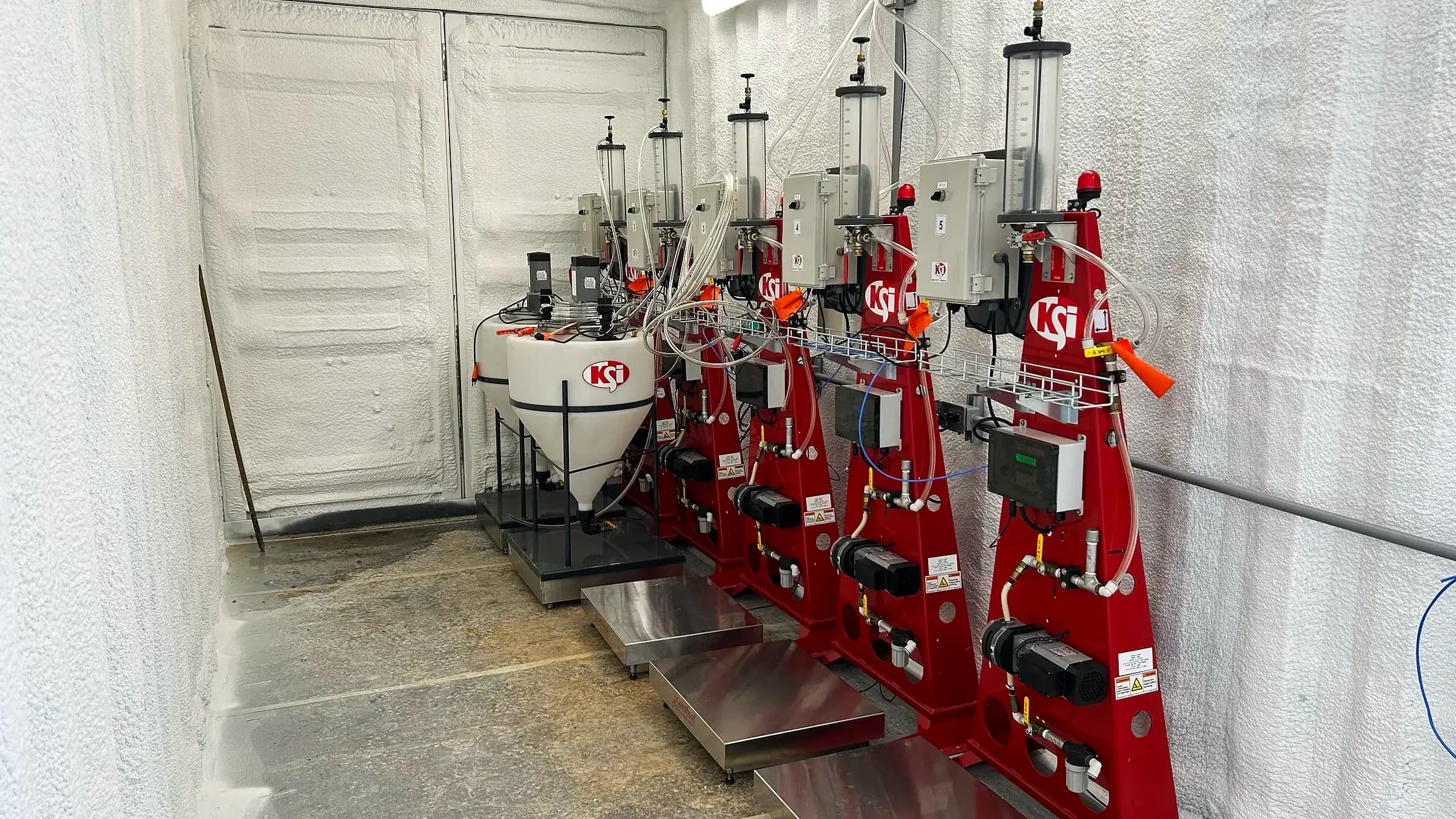 Treatment pump stands on the Bgrow KSI seed-treatment line